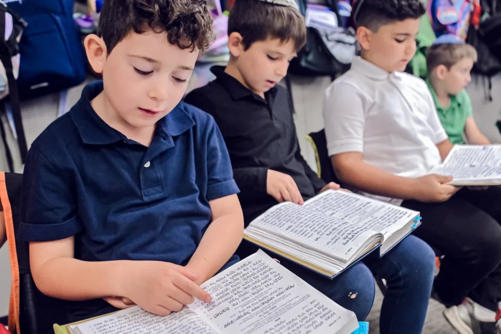 OCA students reading together in class