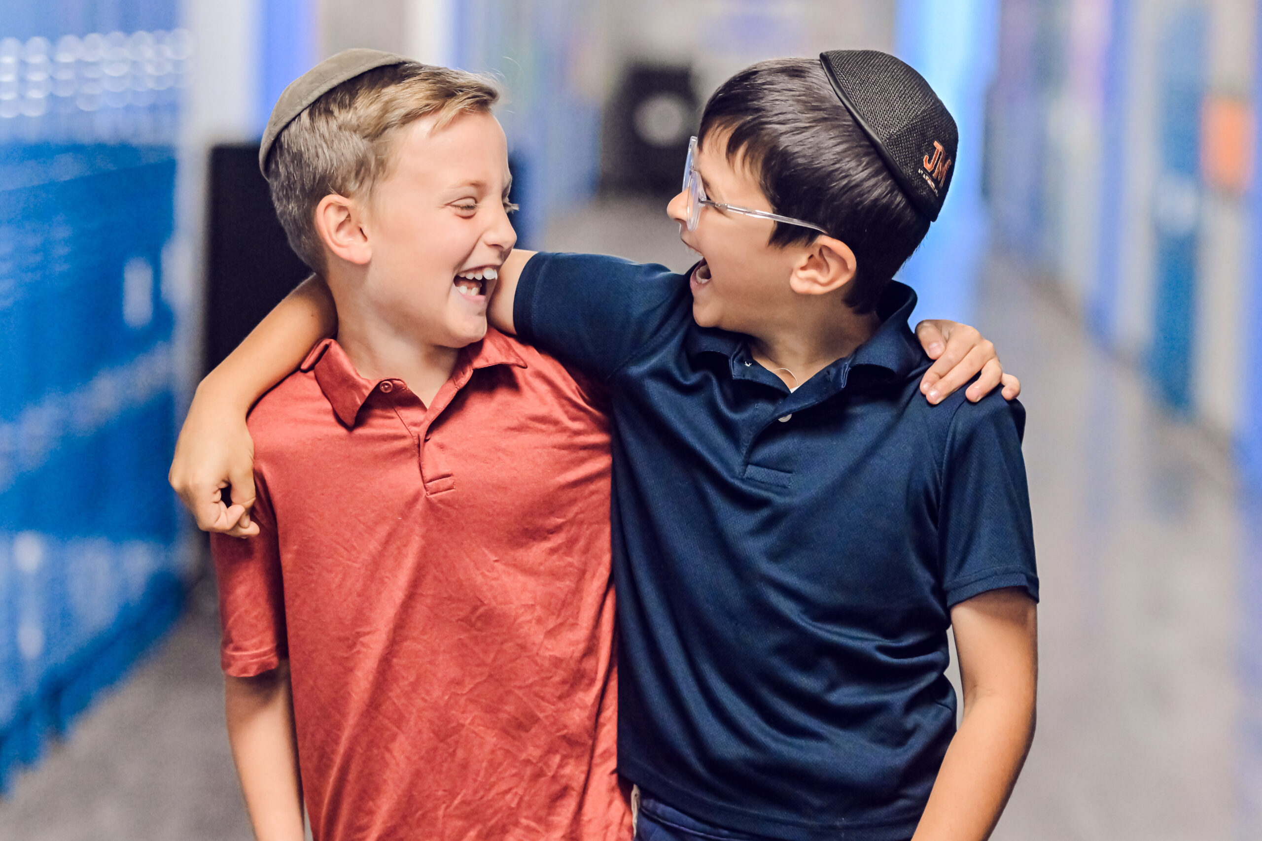 Two OCA students sharing a joyful moment together